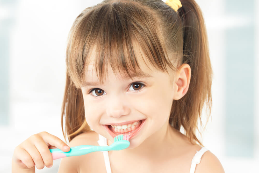 young-girl-caring-for-her-oral-hygiene